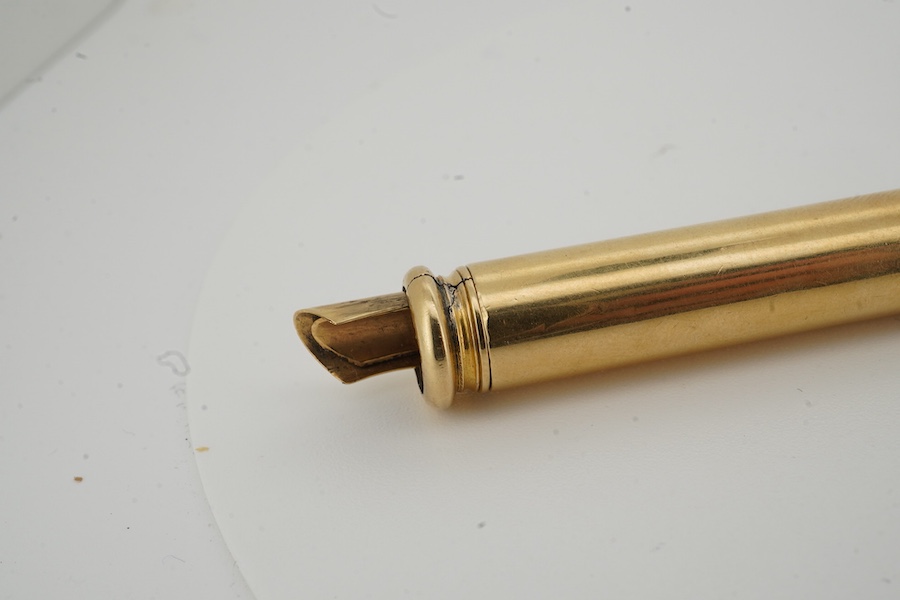 S. Mordan, a gold-cased propelling pen and gold fob, early 20th century, the gold pen with retractable holster for fountain pen nibs, maximum length 11.3cm, signed S. Mordan, gross weight 17 grams; and a gold T-bar fob p